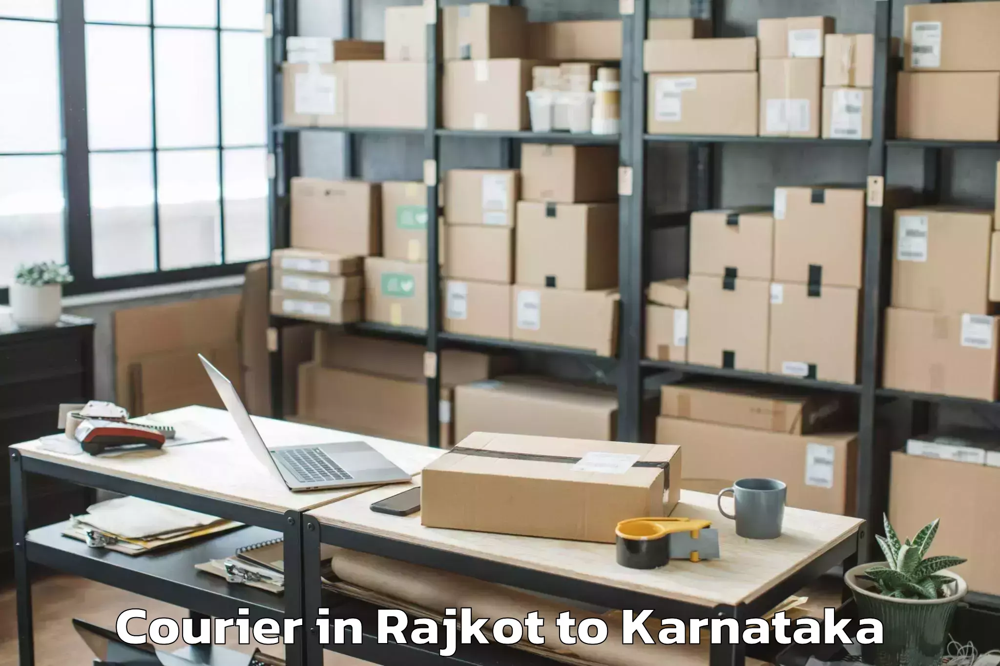 Top Rajkot to Karnataka Janapada Vishwavidya Courier Available